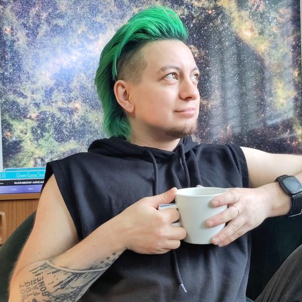 Photo of Zoyander, a small white trans man with green hair