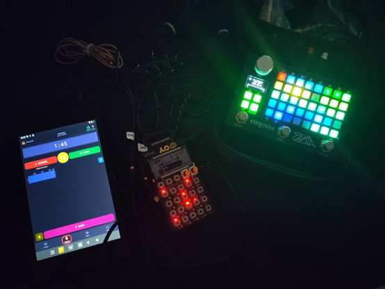 Empress ZOIA with a fully lit up grid of patched modules, Pocket Operator, and a Nexus 7 running the sound journalling app Soundtree